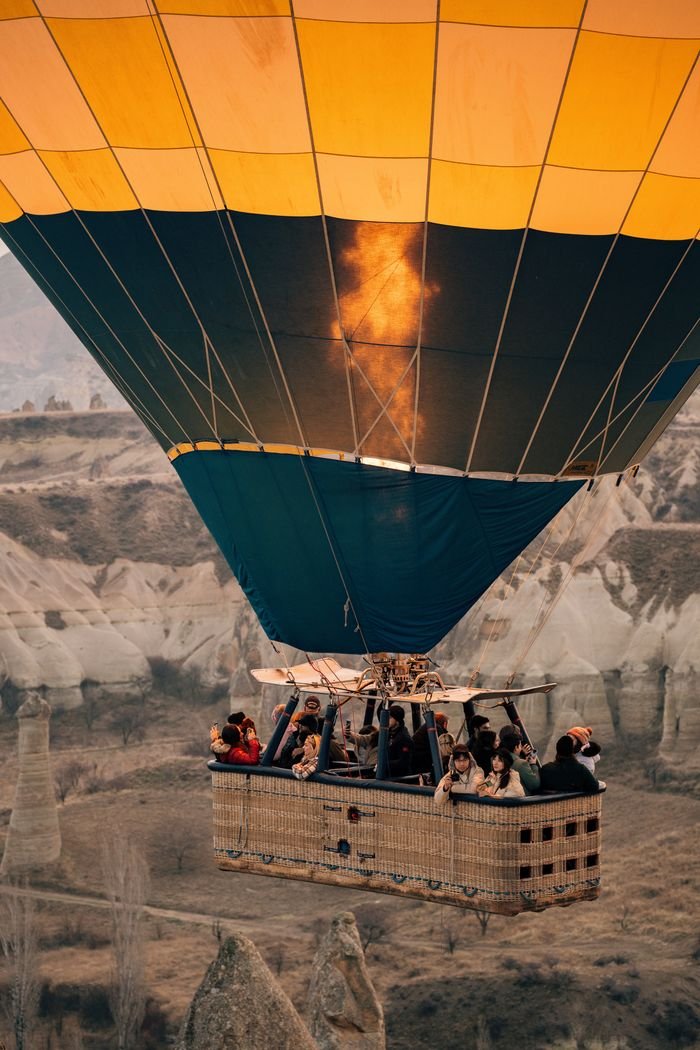 Experience breathtaking views from a hot air balloon ride in Cappadocia, Türkiye.
